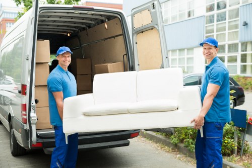Furniture removal team handling bulky items in Earls Court flats