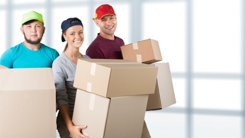 Professional movers navigating access challenges in a West London property