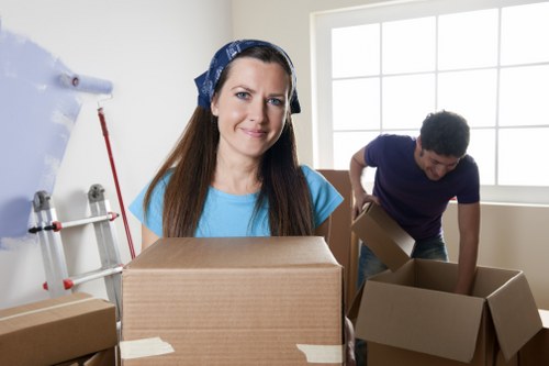 Commercial relocation team handling desks and boxes