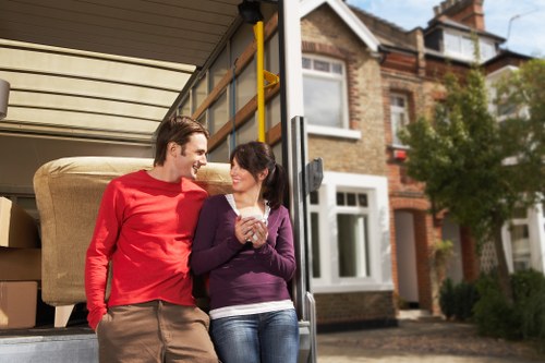 Packed boxes and furniture ready for transport in a West London move
